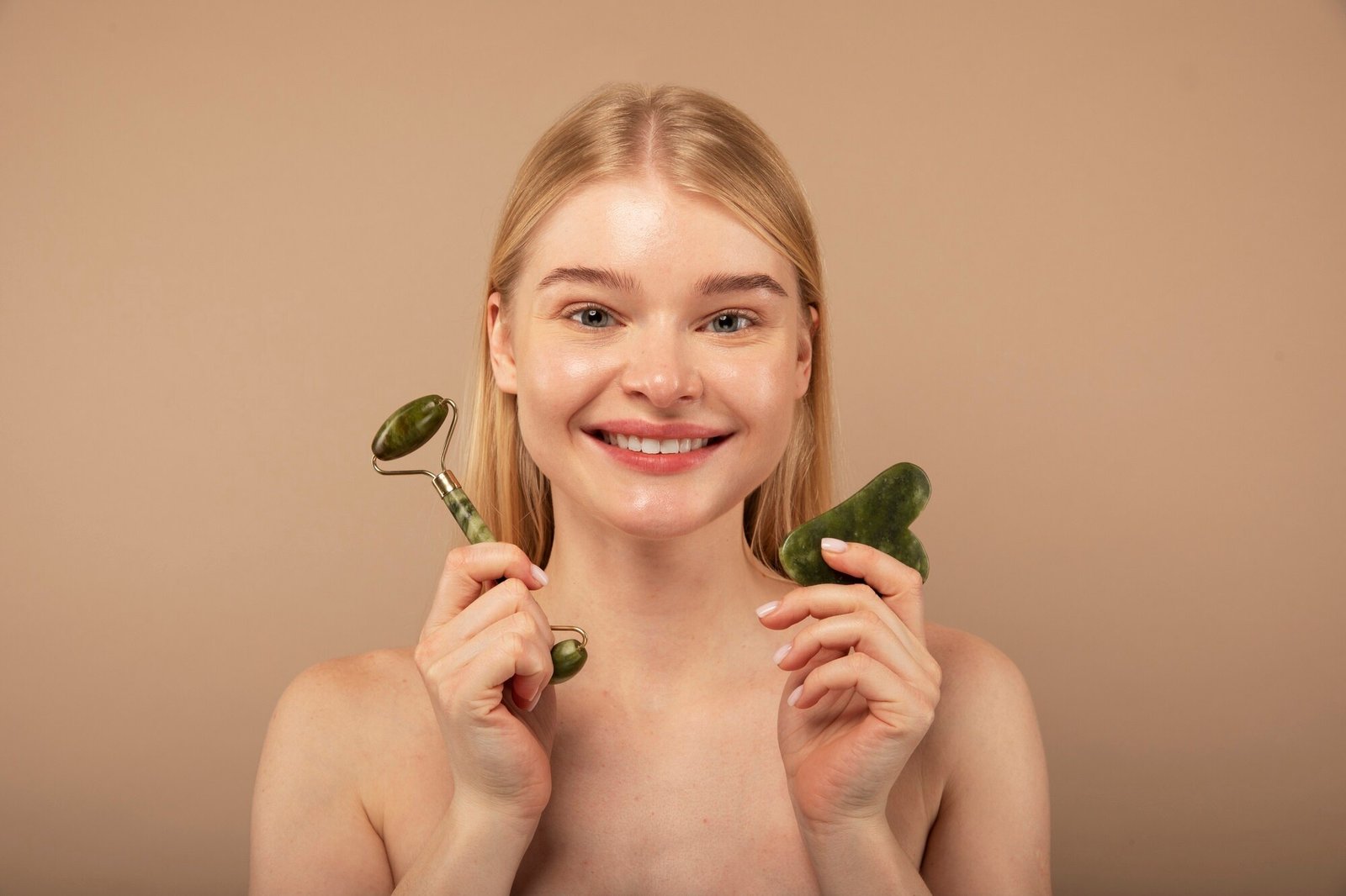 close-up-woman-holding-massaging-tools_23-2149182108